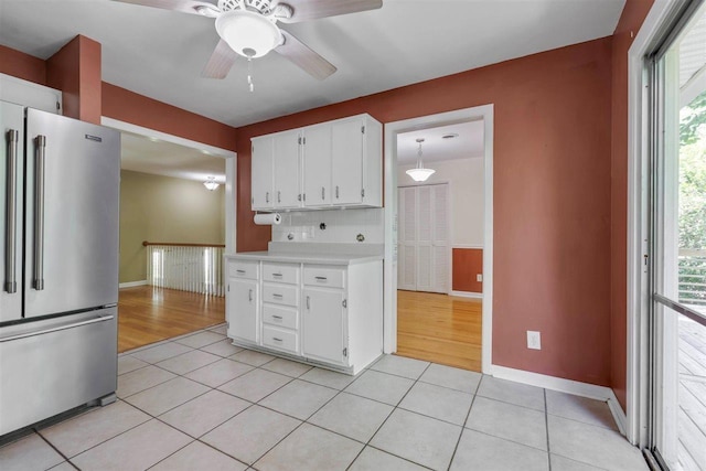 2307 Spoonwood Dr, Tallahassee, FL 32303 - kitchen with high quality fridge, light countertops, baseboards, light tile patterned floors, and ceiling fan