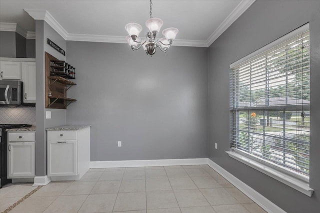 1224 Athens Ct, Tallahassee, FL 32305 - unfurnished dining area featuring a chandelier, healthy amount of natural light, crown molding, light tile patterned flooring, and baseboards