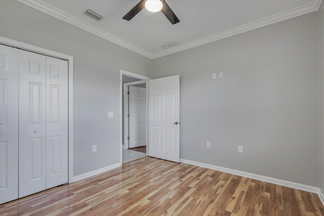 1224 Athens Ct, Tallahassee, FL 32305 - unfurnished bedroom featuring ornamental molding, light wood-type flooring, baseboards, a closet, and a ceiling fan