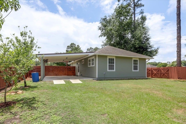 1224 Athens Ct, Tallahassee, FL 32305 - back of house featuring a gate and a carport