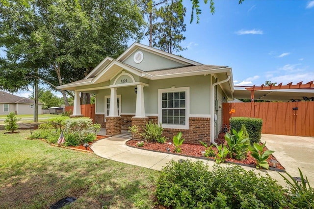 1224 Athens Ct, Tallahassee, FL 32305 - view of front of property featuring brick siding, stucco siding, and covered porch