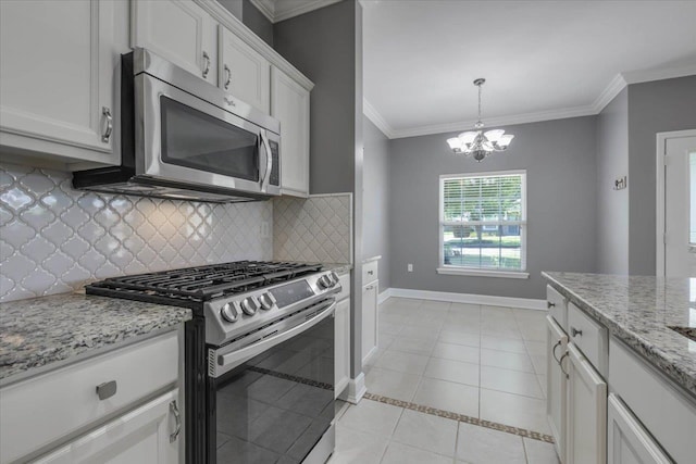 1224 Athens Ct, Tallahassee, FL 32305 - kitchen with appliances with stainless steel finishes, decorative backsplash, ornamental molding, a chandelier, and baseboards