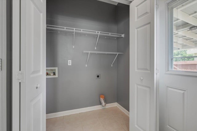 1224 Athens Ct, Tallahassee, FL 32305 - laundry room featuring washer hookup, hookup for an electric dryer, light tile patterned flooring, and baseboards