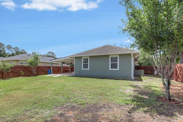 1224 Athens Ct, Tallahassee, FL 32305 - rear view of property with an attached carport, a patio area, roof with shingles, and a gate