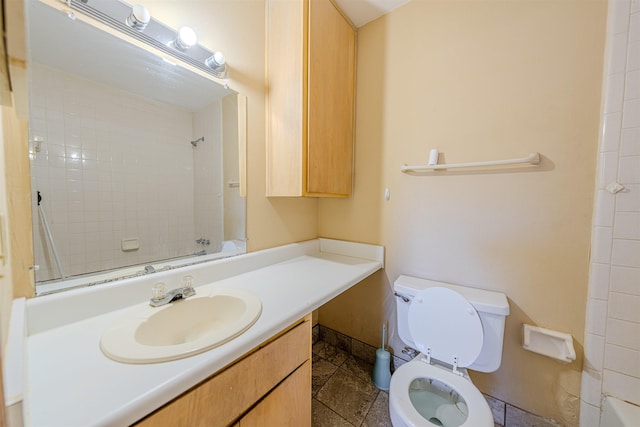 bathroom featuring toilet and vanity