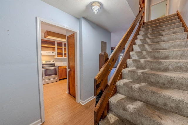 stairway with wood-type flooring