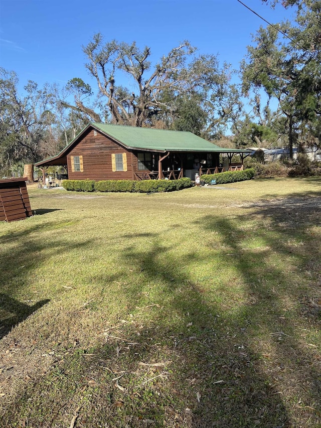 view of yard with a carport