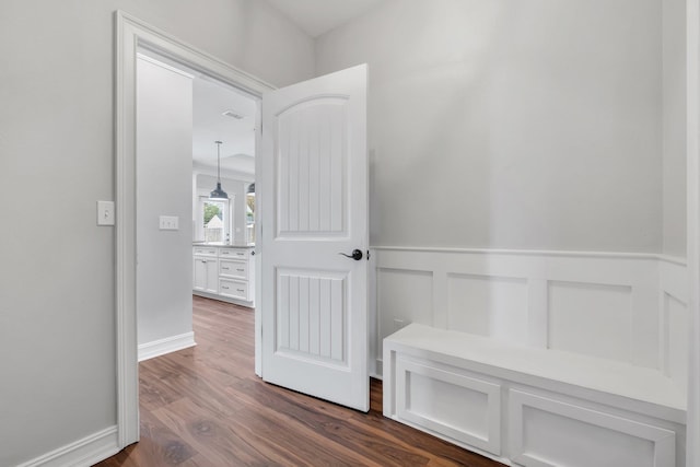 hallway featuring dark wood-type flooring