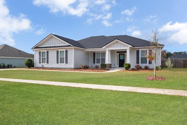 ranch-style home featuring a front yard