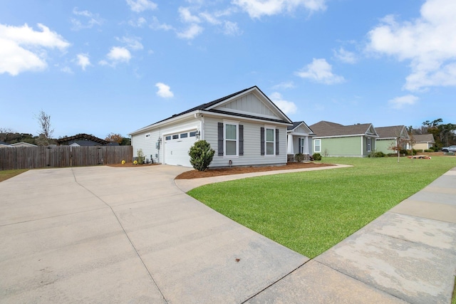 ranch-style house featuring a garage and a front yard