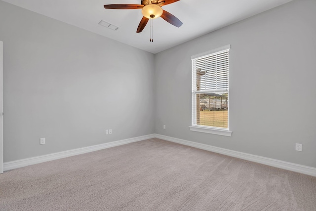 carpeted empty room with ceiling fan