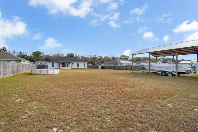 view of yard featuring a fenced in pool