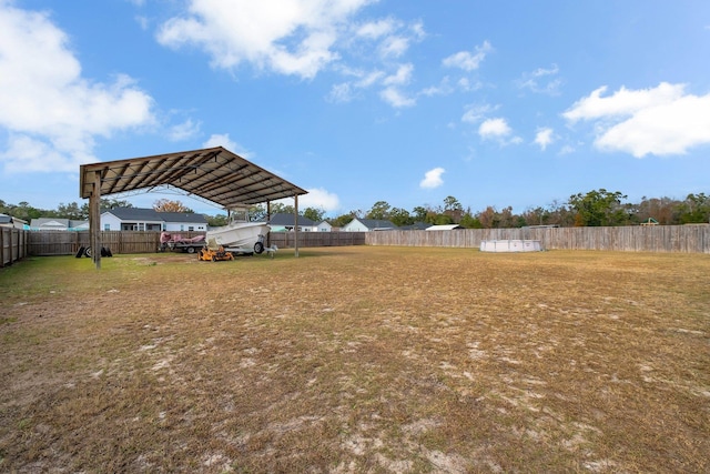 view of yard with a carport