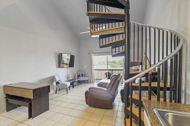 15 NW First St Unit 307, Steinhatchee, FL 32359 - stairs with high vaulted ceiling and tile patterned flooring