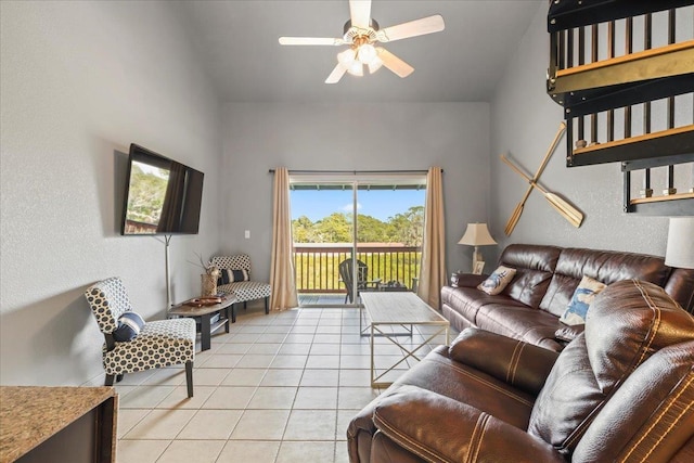 15 NW First St Unit 307, Steinhatchee, FL 32359 - living area with light tile patterned flooring, ceiling fan, and a textured wall