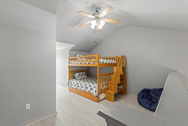 15 NW First St Unit 307, Steinhatchee, FL 32359 - bedroom with lofted ceiling, wood finished floors, and ceiling fan
