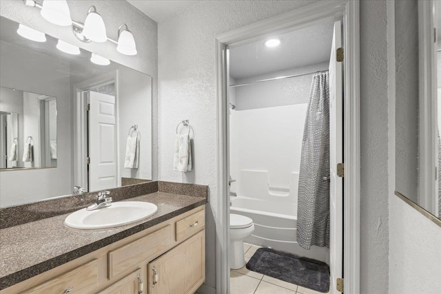 15 NW First St Unit 307, Steinhatchee, FL 32359 - full bathroom with tile patterned flooring, vanity, a textured wall, and shower / tub combo with curtain