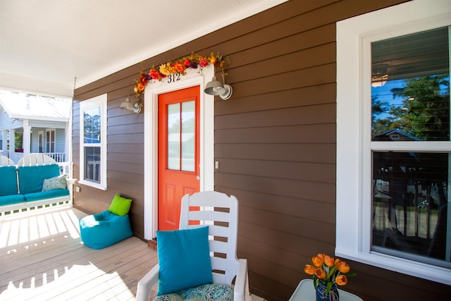 wooden deck featuring covered porch