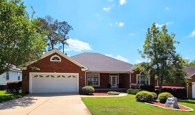 832 Eagle View Dr, Tallahassee, FL 32311 - view of front of home featuring a front lawn, brick siding, and concrete driveway