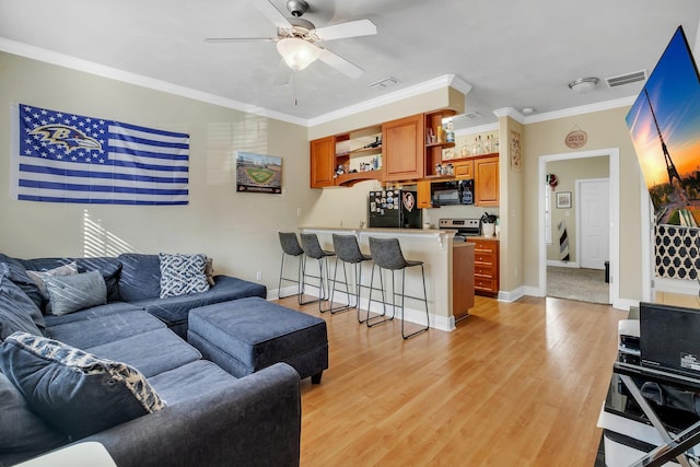 living room featuring crown molding, ceiling fan, and light hardwood / wood-style floors