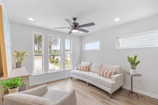 interior space with ceiling fan and light wood-type flooring