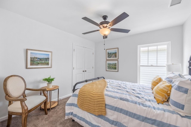 carpeted bedroom featuring a closet and ceiling fan