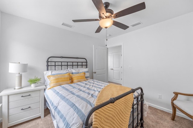 bedroom featuring ceiling fan and light carpet