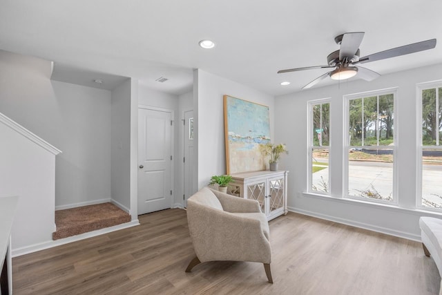 sitting room featuring ceiling fan and wood-type flooring