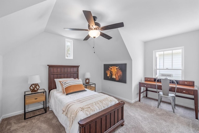 carpeted bedroom with ceiling fan and vaulted ceiling