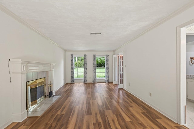 2903 Whirlaway Trl, Tallahassee, FL 32309 - unfurnished living room featuring wood finished floors, a tile fireplace, baseboards, and ornamental molding