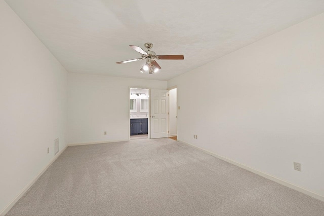 2903 Whirlaway Trl, Tallahassee, FL 32309 - empty room featuring baseboards, light colored carpet, and a ceiling fan