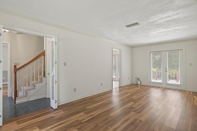 2903 Whirlaway Trl, Tallahassee, FL 32309 - spare room with wood finished floors, french doors, stairway, ornamental molding, and baseboards
