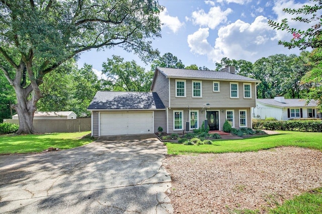 2903 Whirlaway Trl, Tallahassee, FL 32309 - colonial home featuring a chimney, driveway, and an attached garage