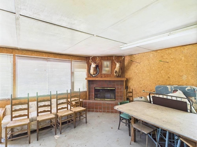 10815 Cooey Island Gr, Perry, FL 32347 - dining space with concrete floors and a tile fireplace