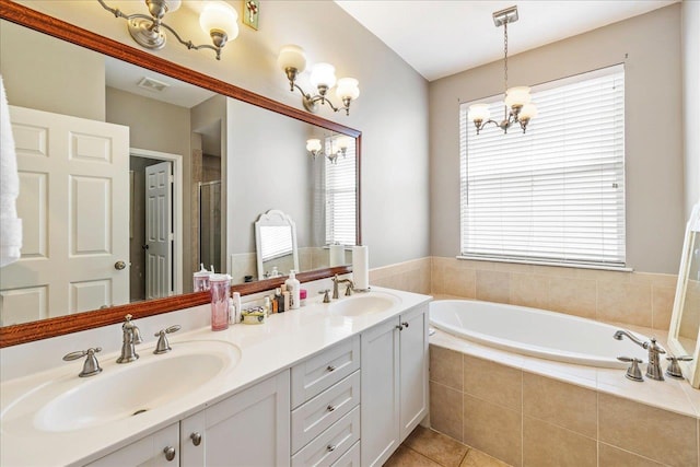 bathroom featuring vanity, a chandelier, independent shower and bath, and tile patterned flooring