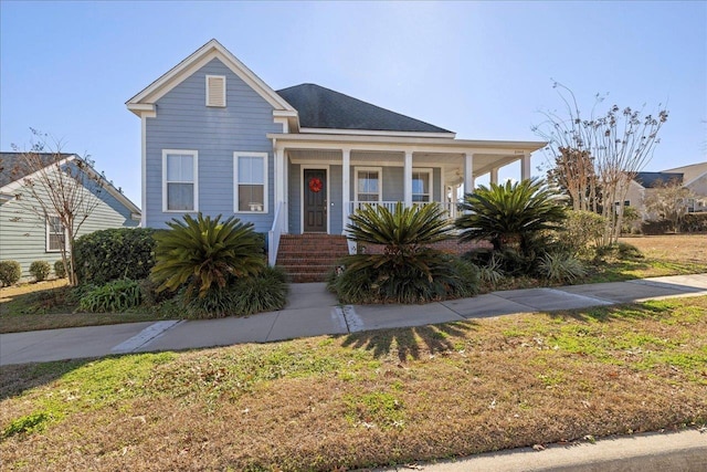 view of front of home featuring a porch and a front lawn