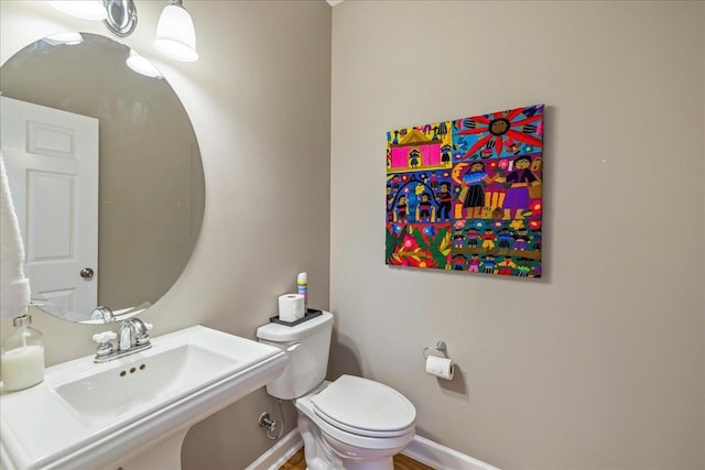 bathroom with sink and toilet