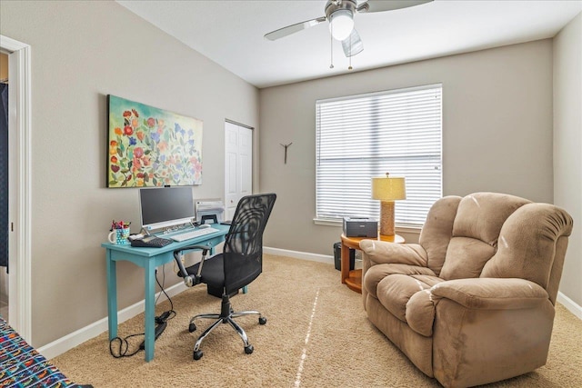 carpeted office space with ceiling fan