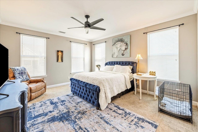 bedroom with carpet flooring, ceiling fan, and ornamental molding