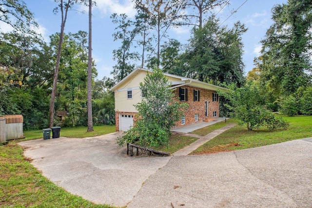 view of side of home featuring a lawn and a garage