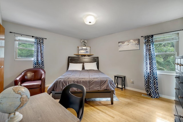 bedroom with light hardwood / wood-style floors