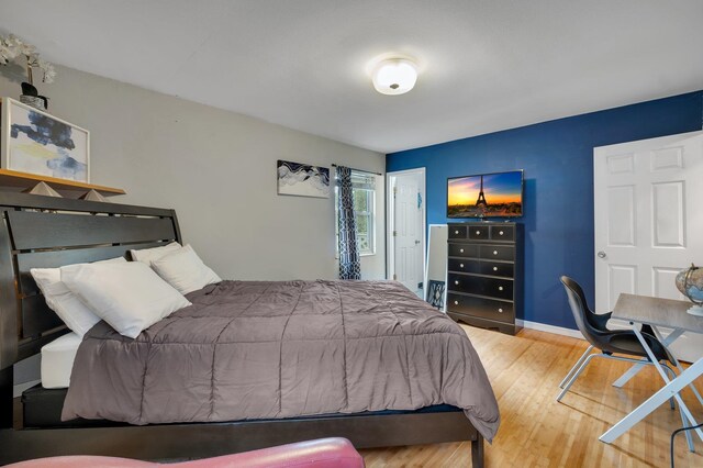 bedroom with hardwood / wood-style flooring