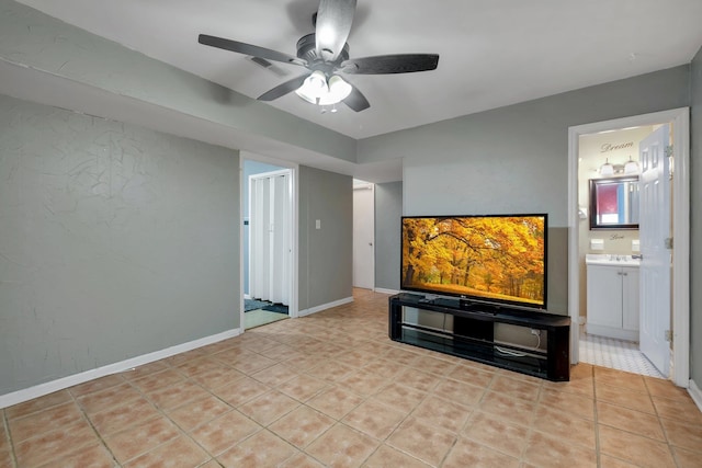 living room featuring light tile patterned floors and ceiling fan