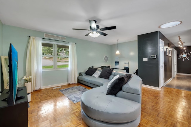 living room with ceiling fan and light parquet floors