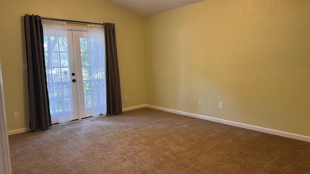 4417 Siesta Ct, Tallahassee, FL 32309 - carpeted empty room featuring vaulted ceiling, baseboards, and french doors
