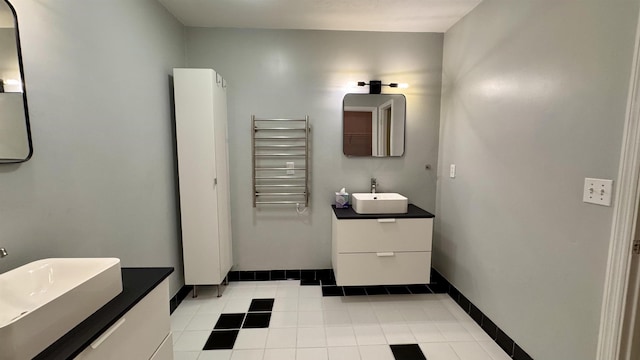 4417 Siesta Ct, Tallahassee, FL 32309 - bathroom featuring radiator, a towel warming rack, vanity, tile patterned flooring, and baseboards