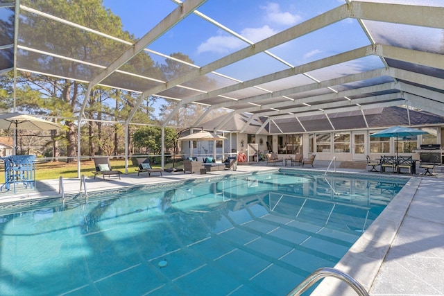 outdoor pool with a patio and a lanai