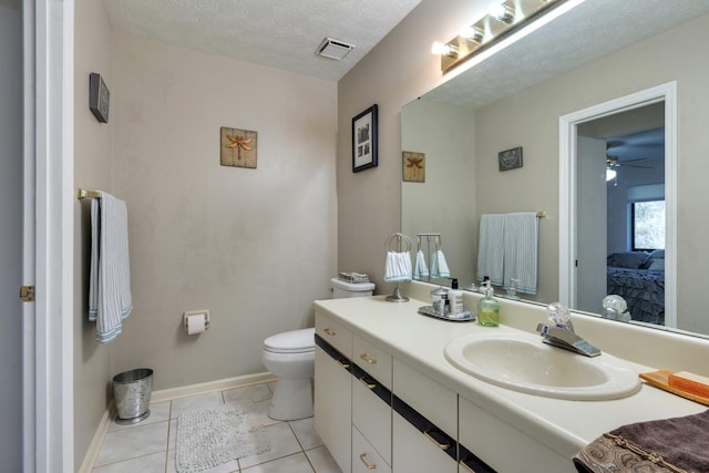 ensuite bathroom featuring toilet, a textured ceiling, ensuite bath, tile patterned flooring, and vanity