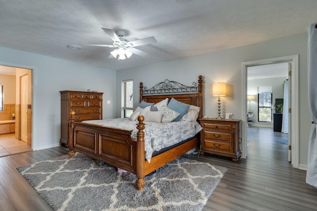 bedroom with ceiling fan, a textured ceiling, and wood finished floors