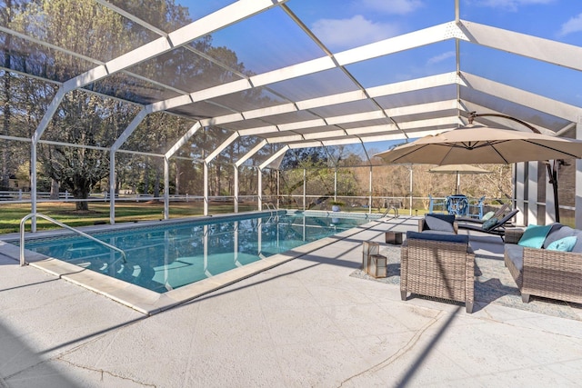 outdoor pool with a patio and a lanai